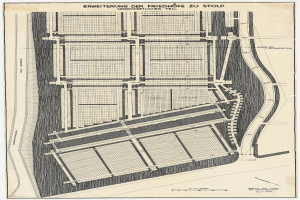Alte Stadtkarte mit detaillierten Gebäudeplänen, Straßenplänen und handschriftlichen Textanmerkungen.
