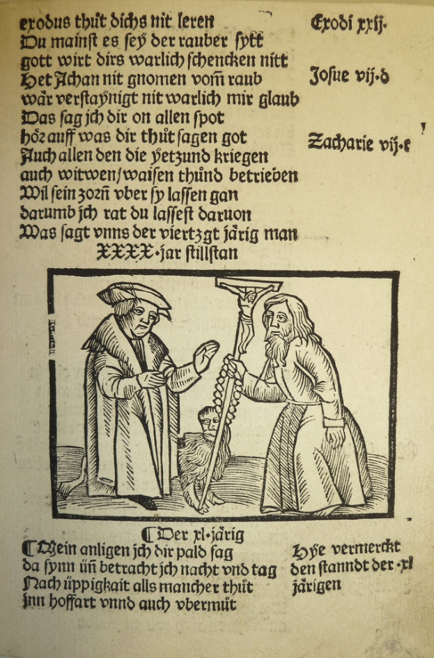 Ein bedrucktes Papier in einer fremden Sprache mit zwei Männern im Hintergrund, möglicherweise aus einem Lehrbuch.