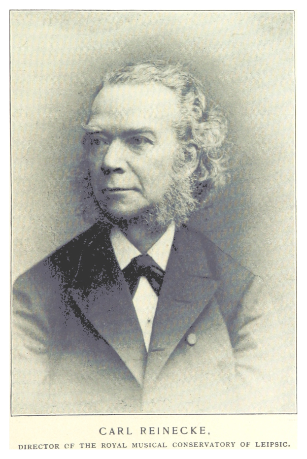 Schwarzes und weißes Foto von Carl Reinecke, dem Direktor des Königlichen Musikalischen Konservatoriums Leipzig, der einen Anzug trägt, mit Text unten auf dem Bild.